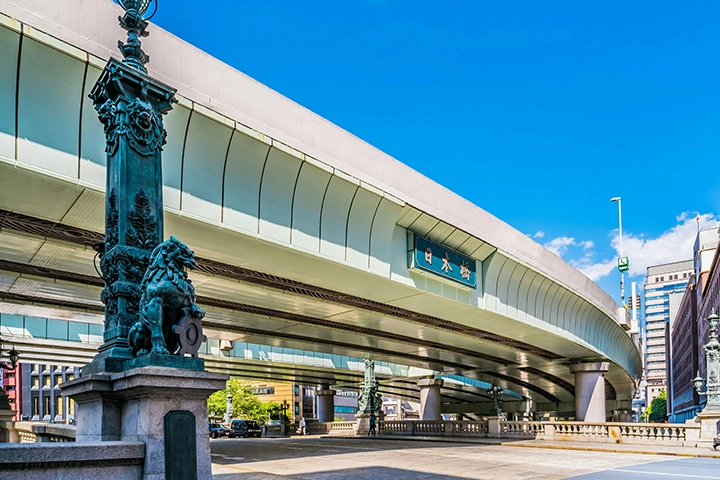 The Nihonbashi bridge, with an elevated highway running overhead and ornate bronze statues on its railings.