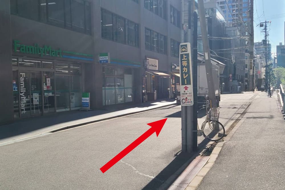 The exterior of the building housing [FamilyMart].