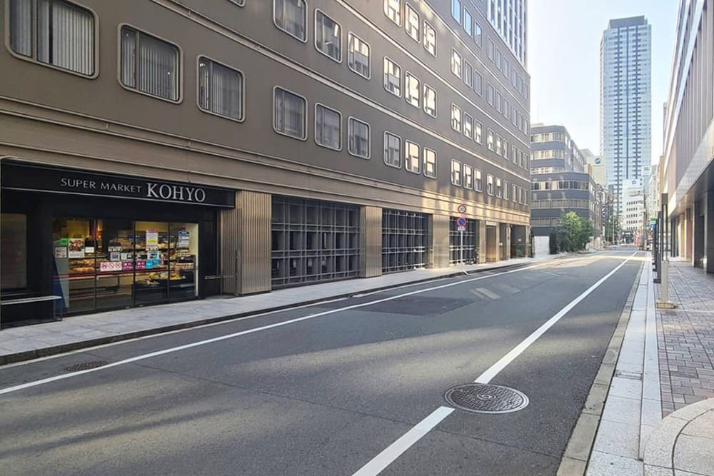 The road with [SUPER MARKET KOHYO] on the left.