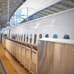 A Shinkansen train stopped on the station platform