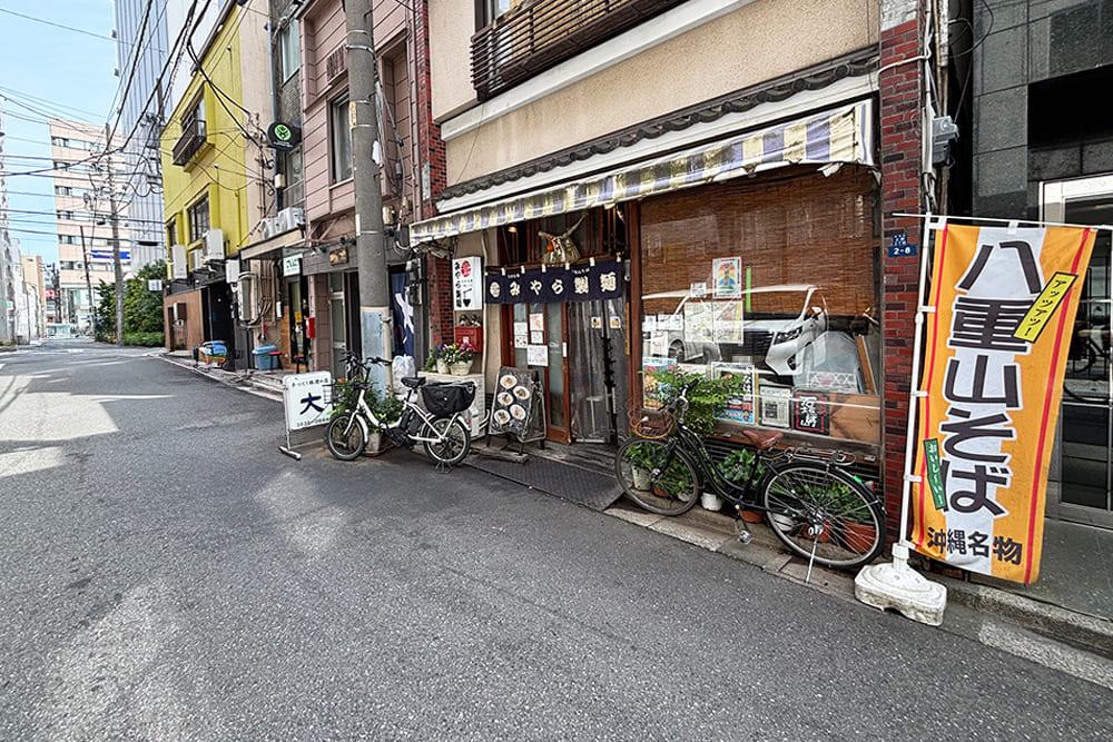 A street in the Ueno area, with [Yaeyama-soba Miyara Seimen] on the right.
