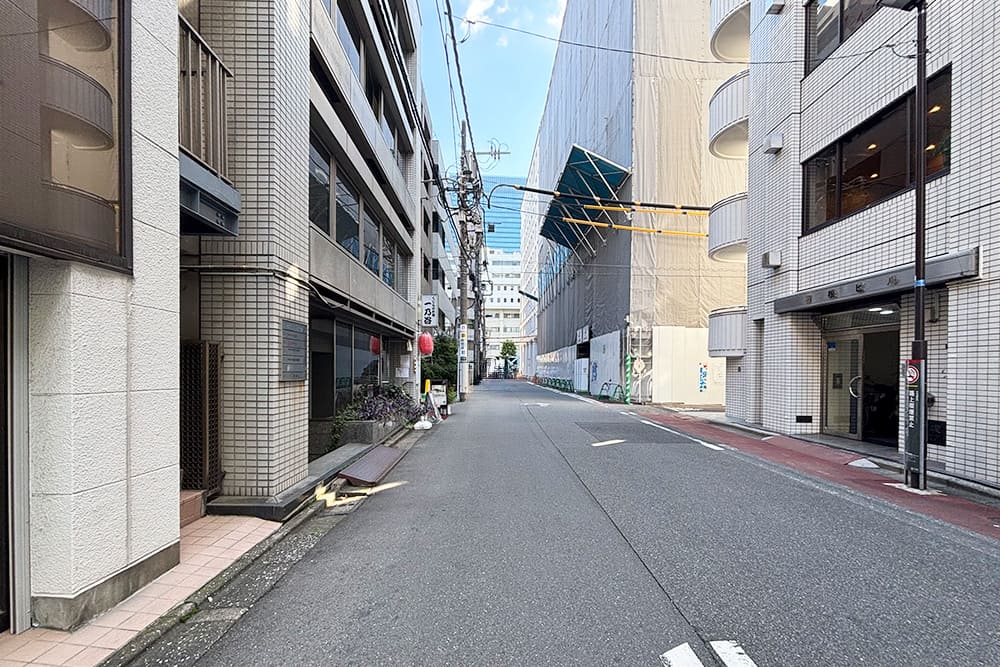 Alleyway lined with buildings.